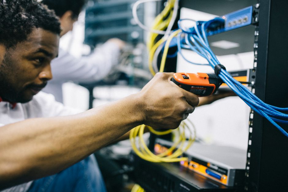 engineer inspecting server equipment