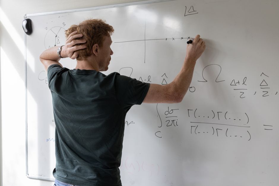 whiteboard with equations and graphs