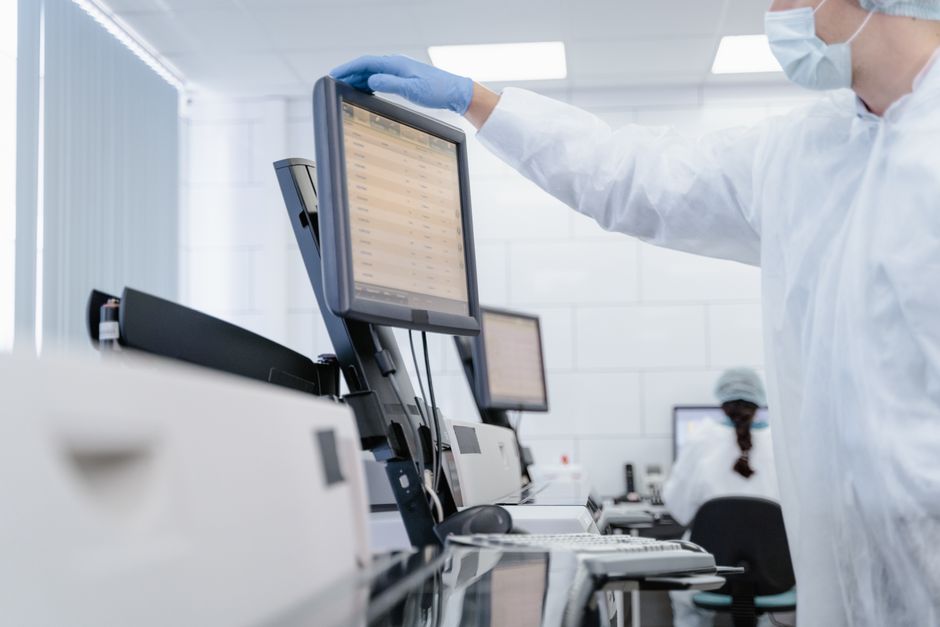 scientist reviewing images on monitor