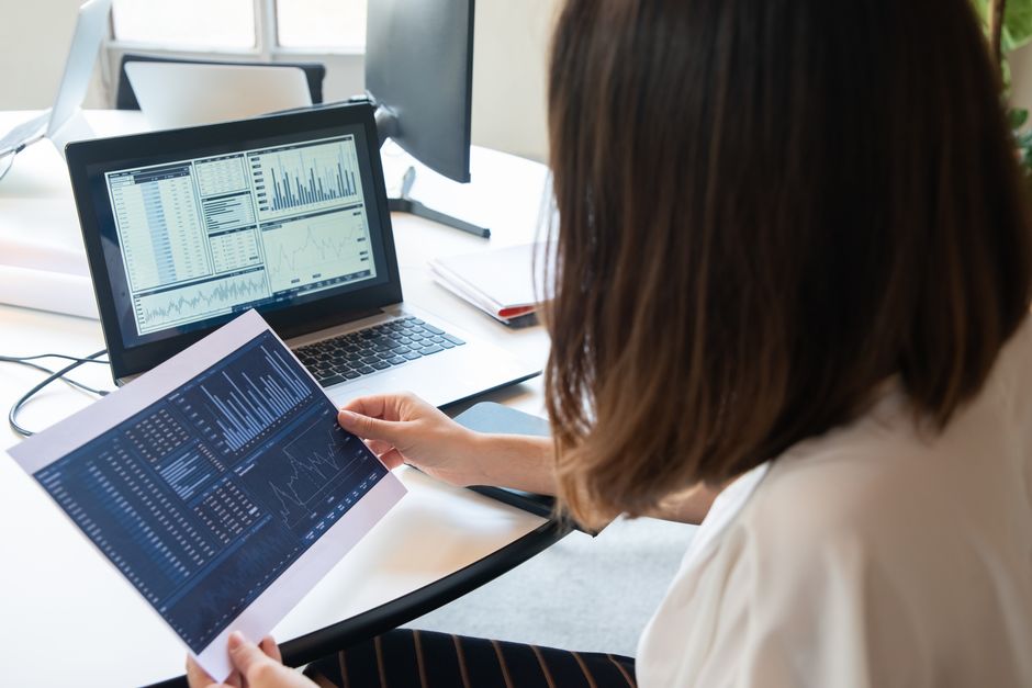 person reviewing charts on screen
