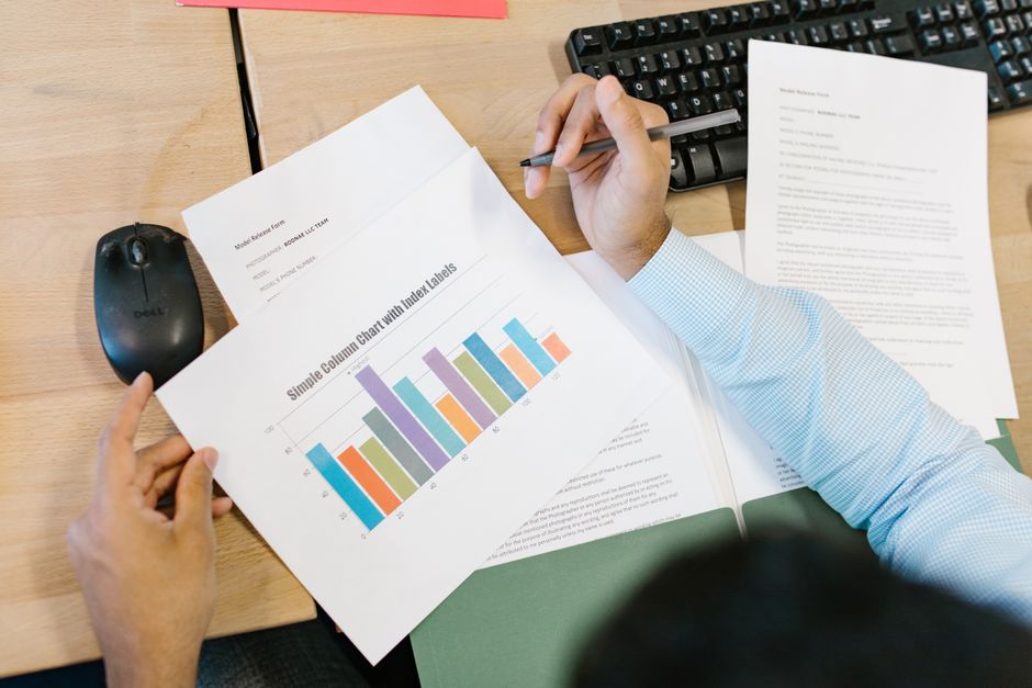 two researchers comparing spreadsheet data