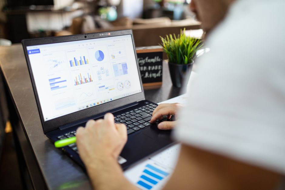 laptop with data charts