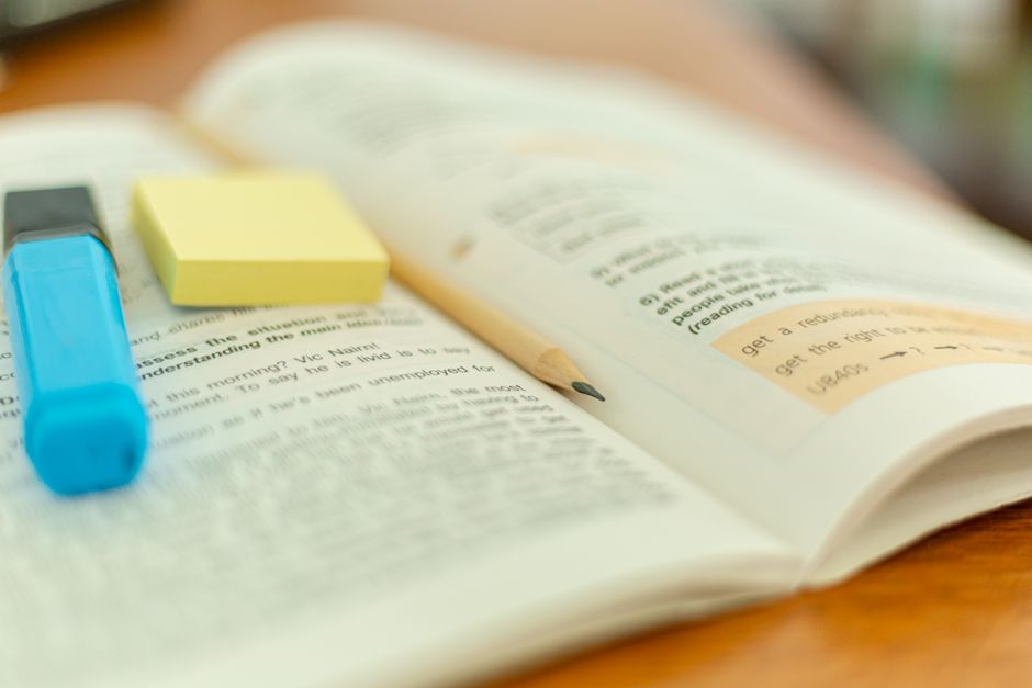 open book highlighted text pronoun reference