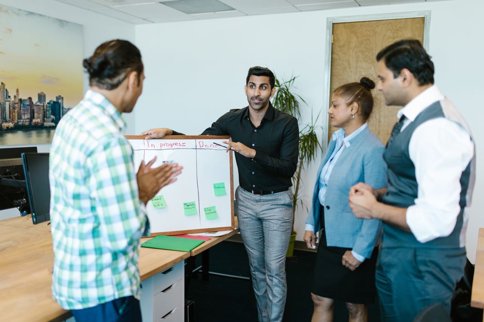 business meeting whiteboard discussion