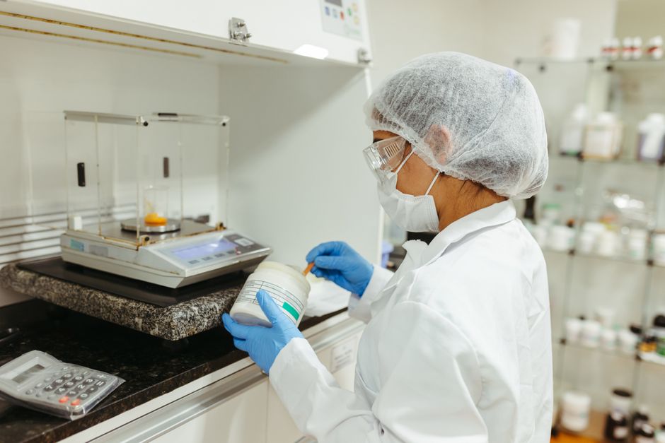 researcher weighing two options at a desk