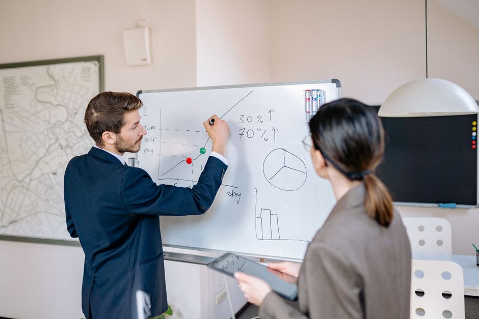 office whiteboard with data diagrams