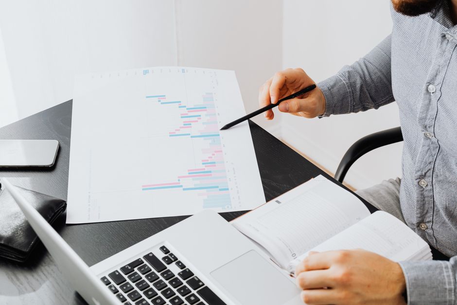 scientist reviewing data charts on laptop