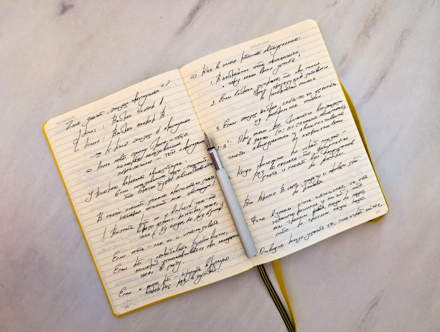 open notebook with handwritten notes