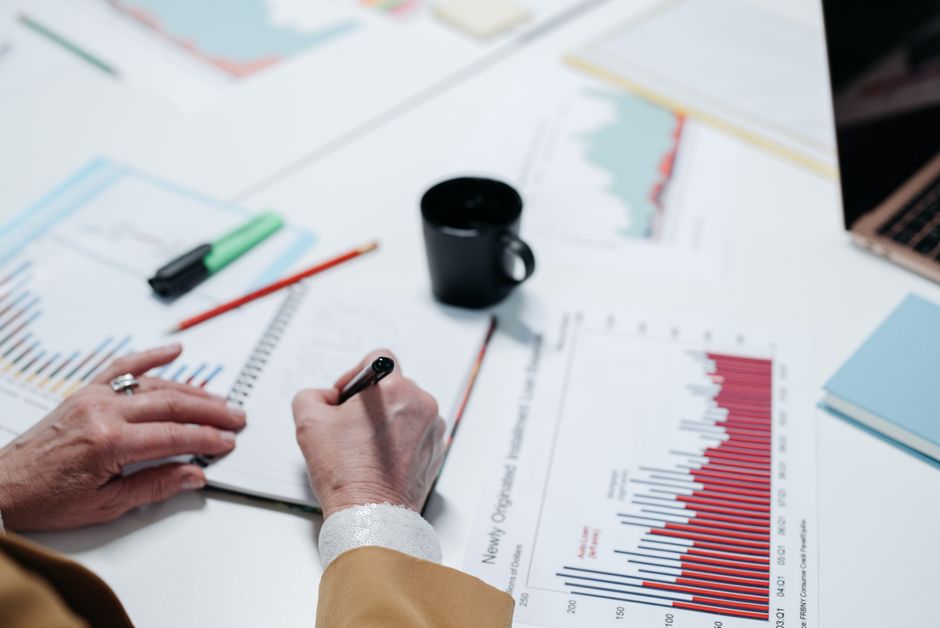 open notebook with charts and data tables