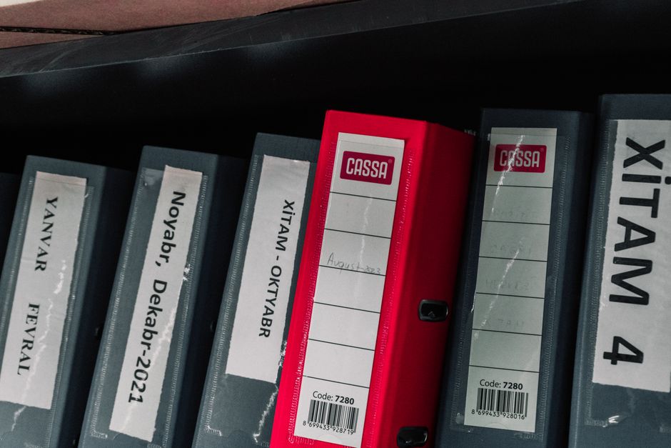 stack of colour coded document folders