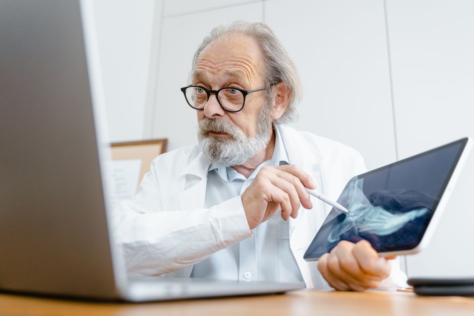 researcher checking results on laptop