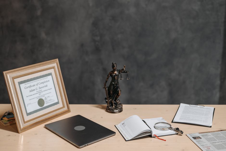 certificate on desk with laptop