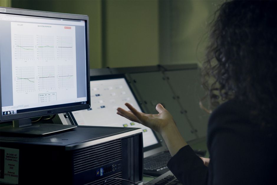 engineer reviewing data on monitor