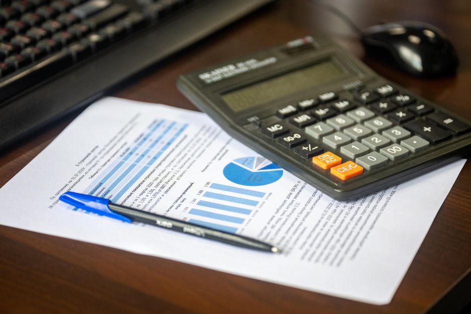 financial documents and calculator on desk