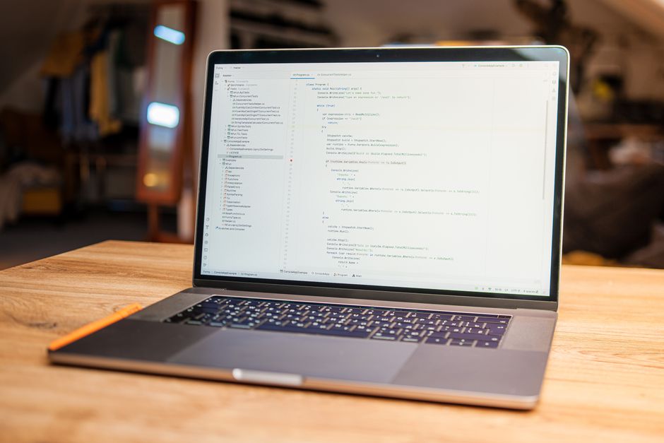 laptop with code editor open on desk