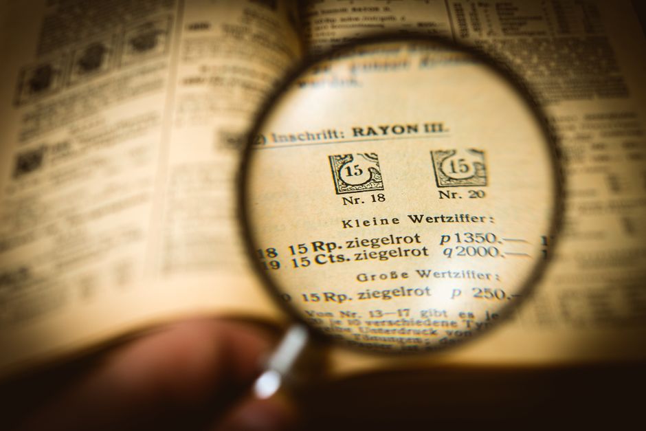 magnifying glass over documents