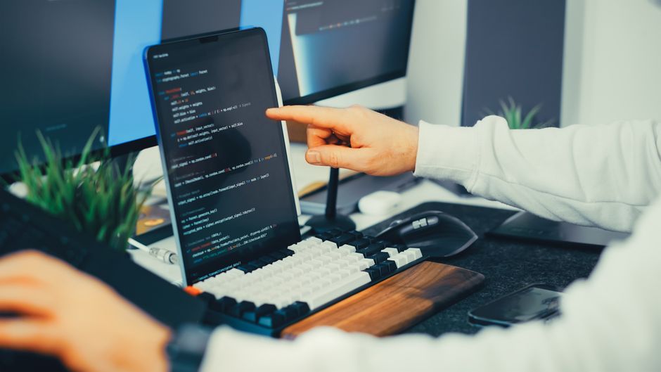 engineer reviewing data on laptop